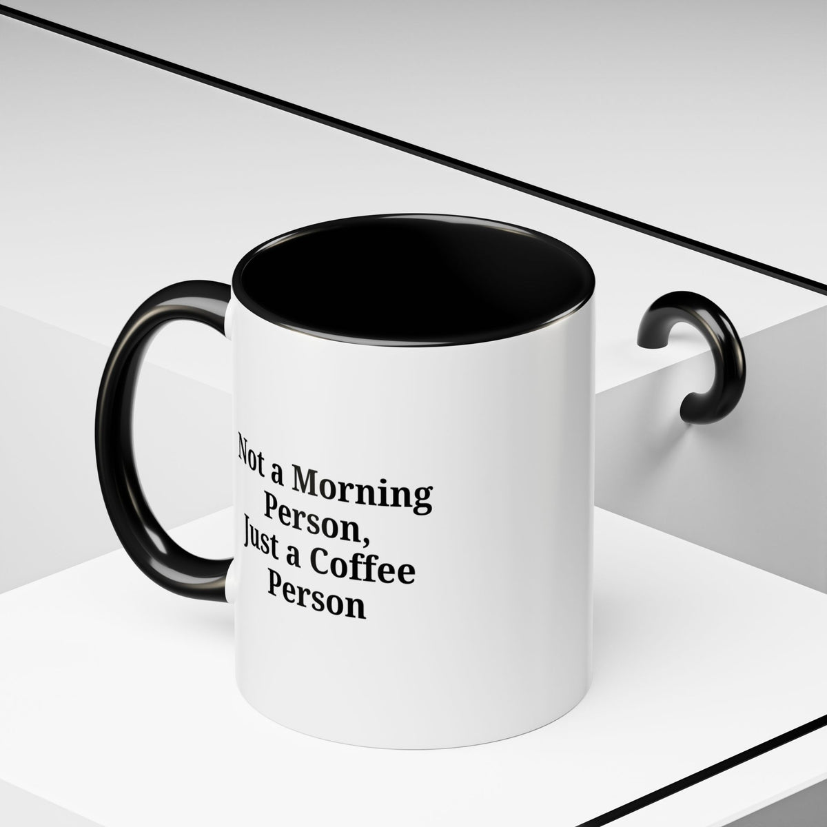 Ceramic coffee mug with "Not a Morning Person, Just a Coffee Person" printed in black text on white background.
