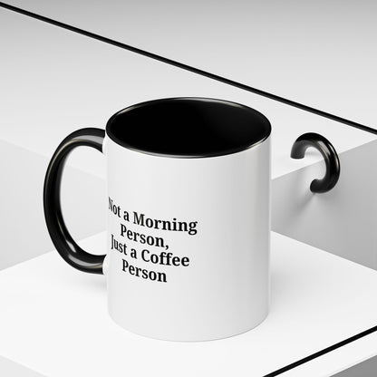 Ceramic coffee mug with "Not a Morning Person, Just a Coffee Person" printed in black text on white background.