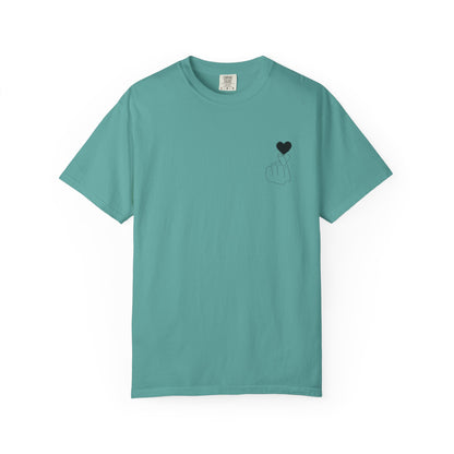 Black T-shirt with minimal white finger heart graphic design, casual style, by Printify.