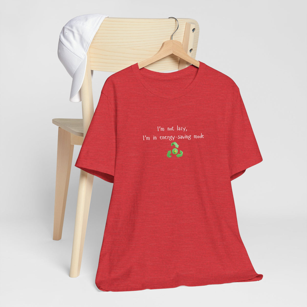 Eco humor T-shirt from Printify featuring a mock slogan, "I'm Not Lazy, I'm an Energy-Saving Mock" on a casual T-shirt.