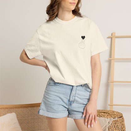 Black T-shirt with a minimal white finger heart graphic, casual Printify men's or women's tee, soft cotton material.
