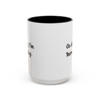 Ceramic coffee mug with "Go Away, I'm Introverting" quote in black text, 11 oz size, ideal for introverts.