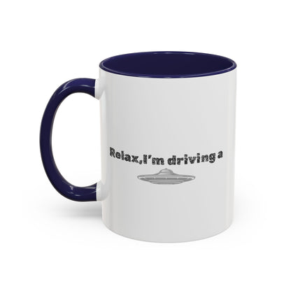 Ceramic coffee mug with "Relax, I’m Driving" UFO design, 11 oz, printed by Printify featuring a fun alien spaceship graphic.