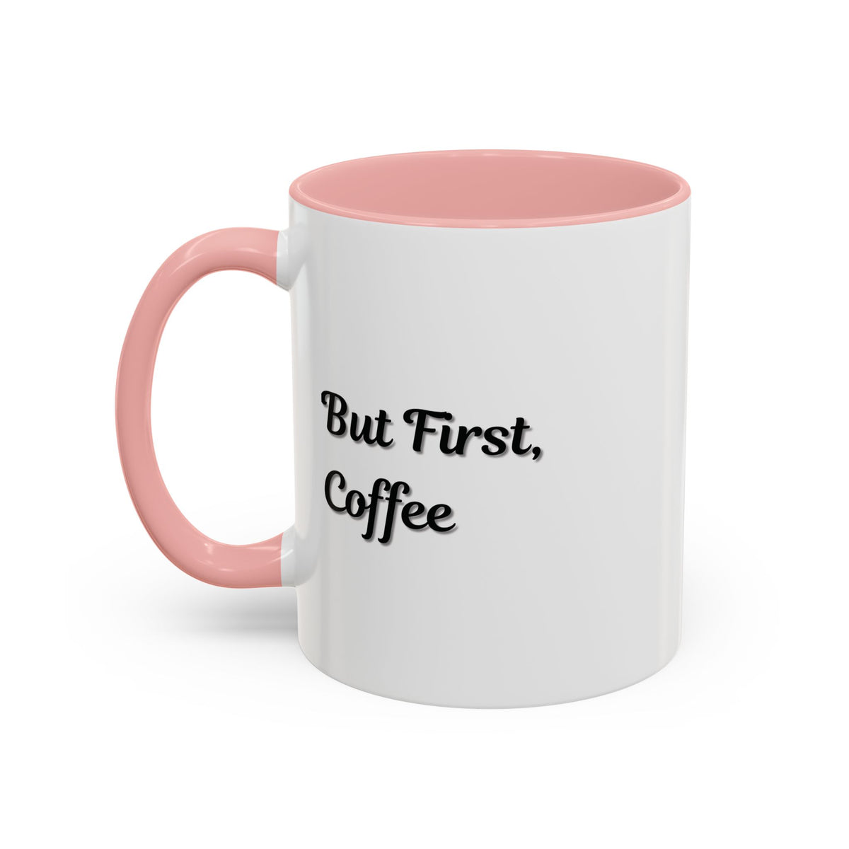 Black handle and rim coffee mug with "But First Coffee" print, 11oz ceramic mug by Printify, shown from a front view.