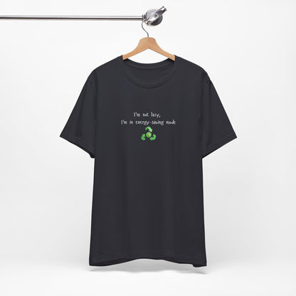 Eco humor T-Shirt featuring "I’m Not Lazy, I’m an Energy-Saving Mock" print, casual unisex tee by Printify.