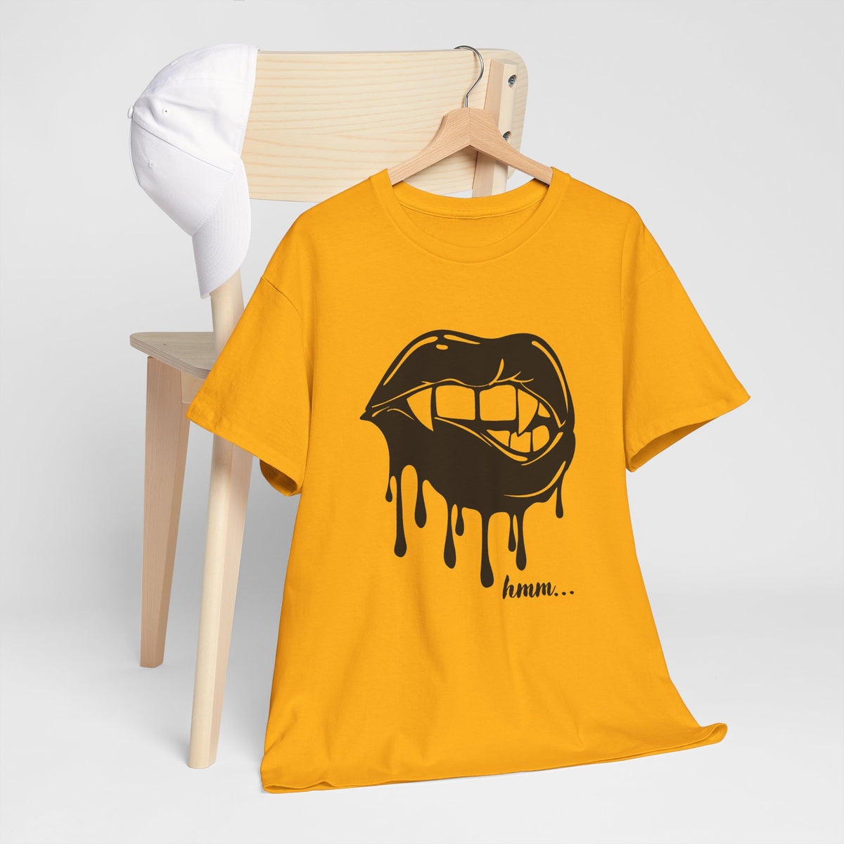 Black graphic T-shirt by Printify featuring dripping lips with "hmm..." bite design on the front.
