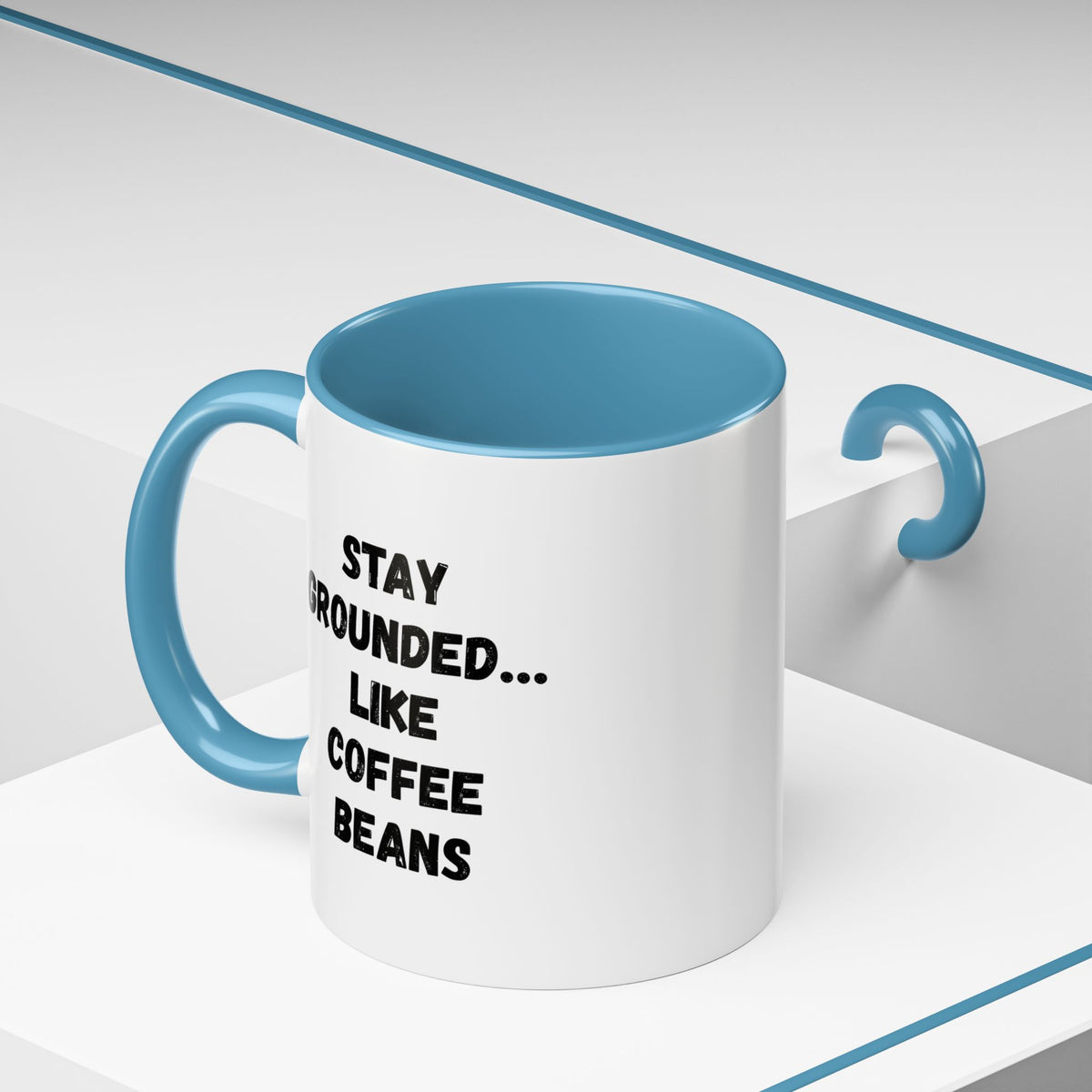 White ceramic coffee mug with "Stay Grounded Like Coffee Beans" printed design, perfect for coffee lovers, 11oz size.