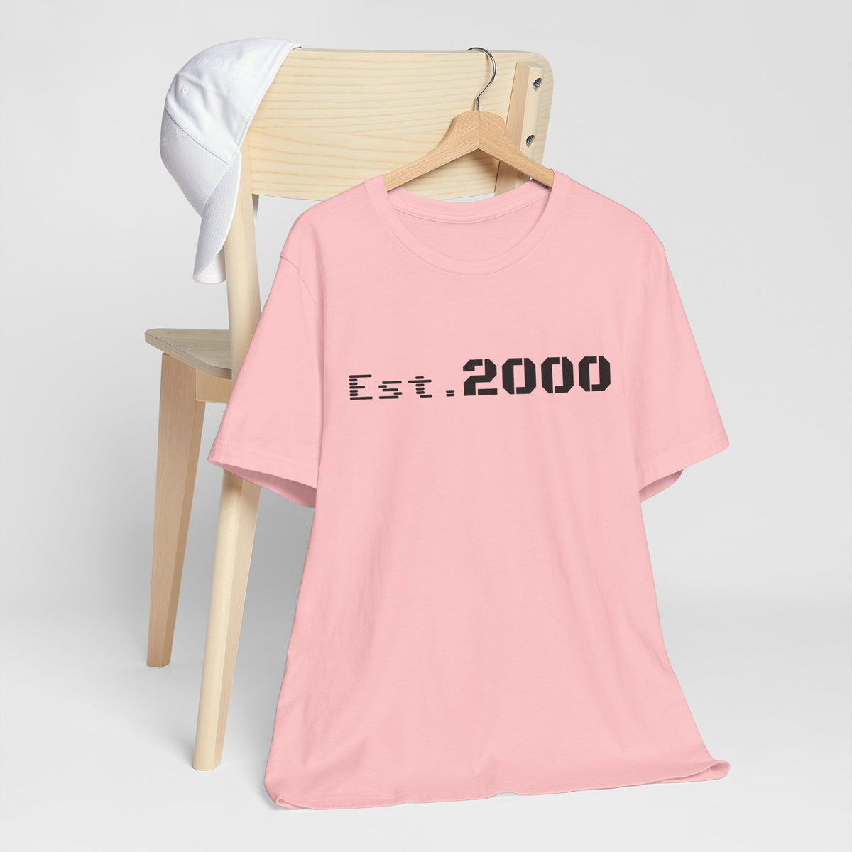 Retro pixel T-shirt with "Born in 2000" text, vintage style design, printed by Printify, on a casual unisex t-shirt.