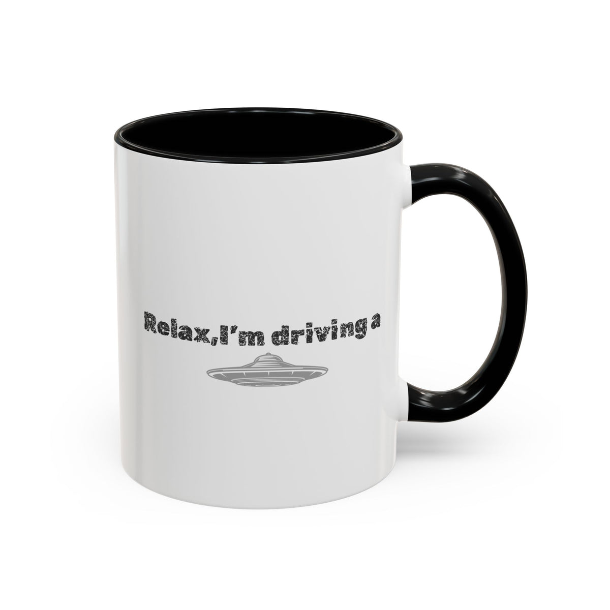 Ceramic coffee mug with "Relax, I’m Driving" UFO accent design, 11 oz, featuring a playful extraterrestrial theme.
