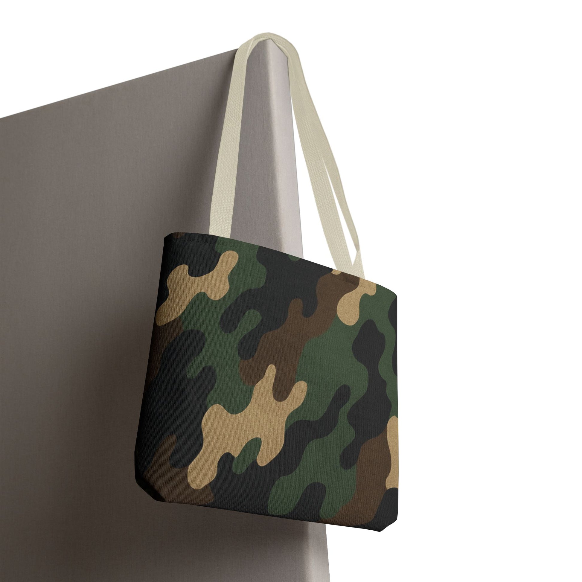 Camo pattern tote bag made of canvas, featuring an all-over camouflage print, designed for casual carrying and style.