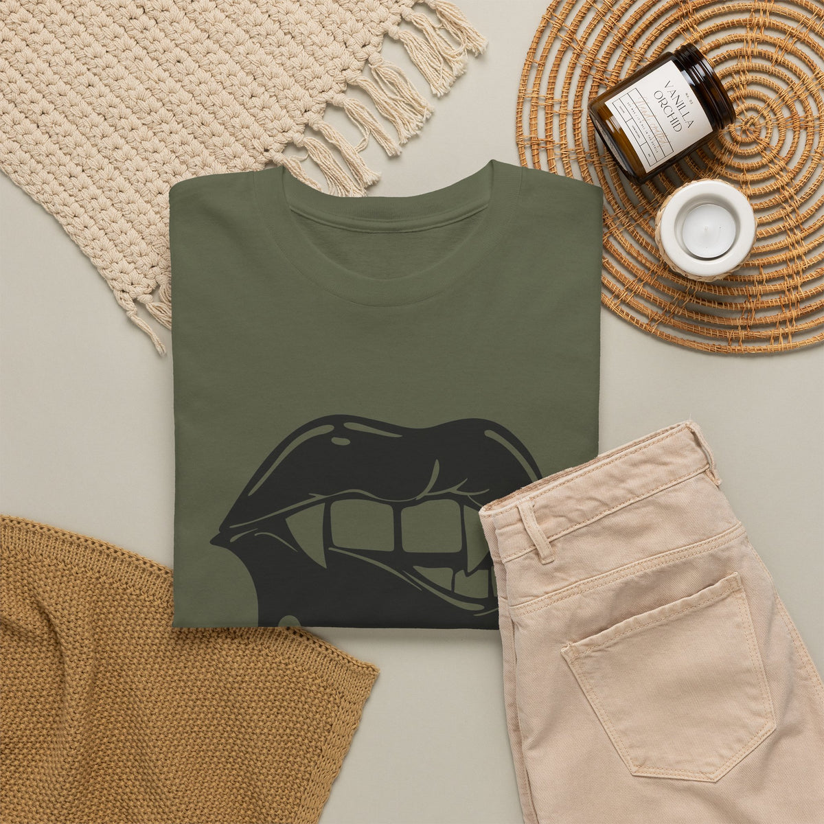 Black graphic t-shirt by Printify featuring dripping lips with "hmm..." bite design on the front.