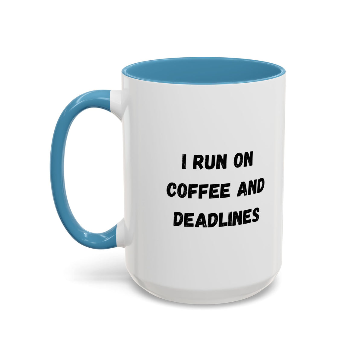 White ceramic coffee mug with black text reading "I Run on Coffee and Deadlines," displayed on a wooden surface.