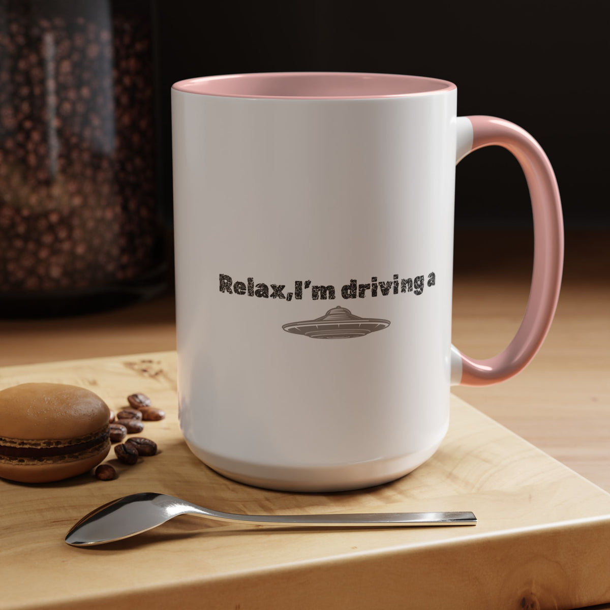 Ceramic coffee mug with "Relax, I’m Driving" text and UFO accent design, available in 11 or 15 oz sizes.