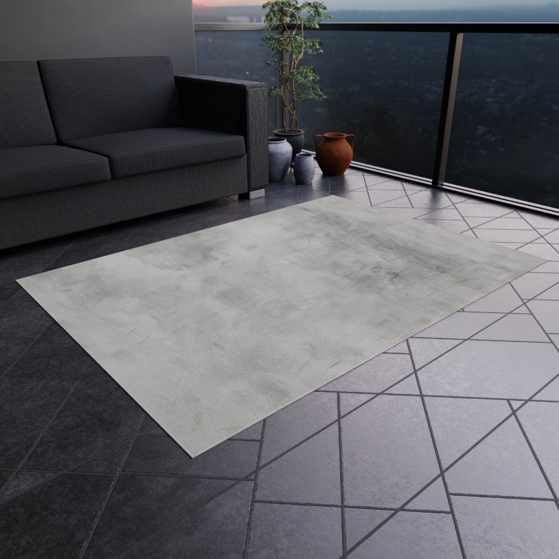 Modern gray outdoor rug by Printify, indoor-outdoor flooring ideal for patios and decks, shown laid out on a deck surface.