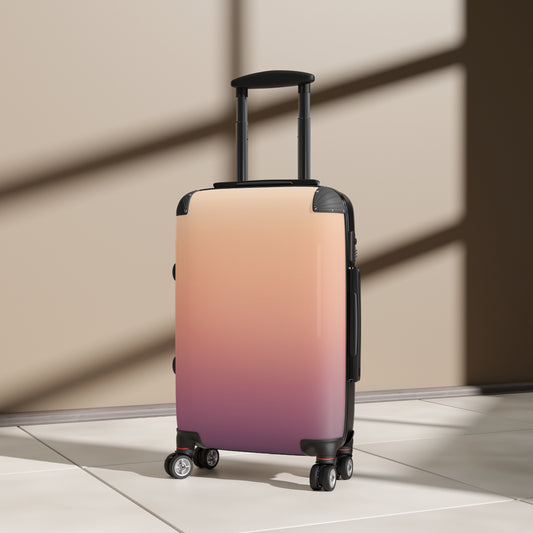 Gradient ombre carry-on suitcase in sunset pink to plum, stylish travel luggage by Printify with durable bag design