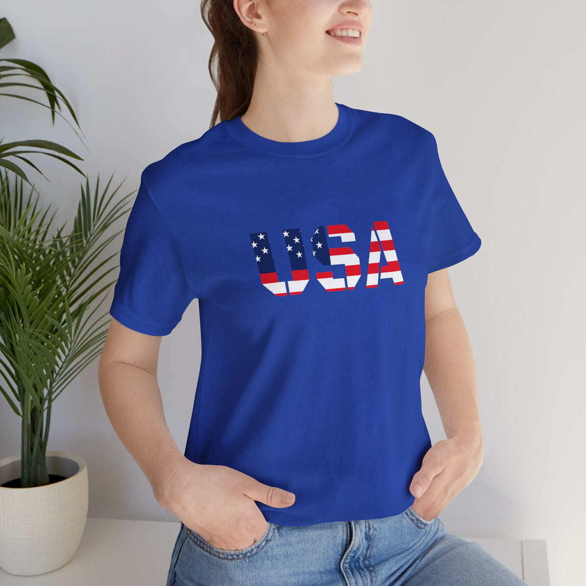 USA flag text T-shirt by Printify featuring patriotic design, perfect for Fourth of July celebrations.