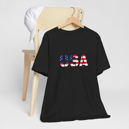 USA flag text T-shirt by Printify featuring patriotic Fourth of July design, with bold flag imagery on a casual cotton tee.