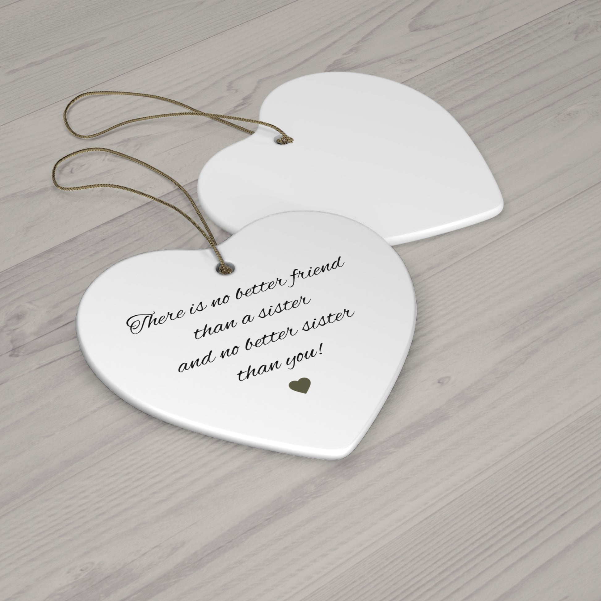 Ceramic "There is No Better Friend Than a Sister" heart ornament with engraved message, ideal for gifting or home decor.