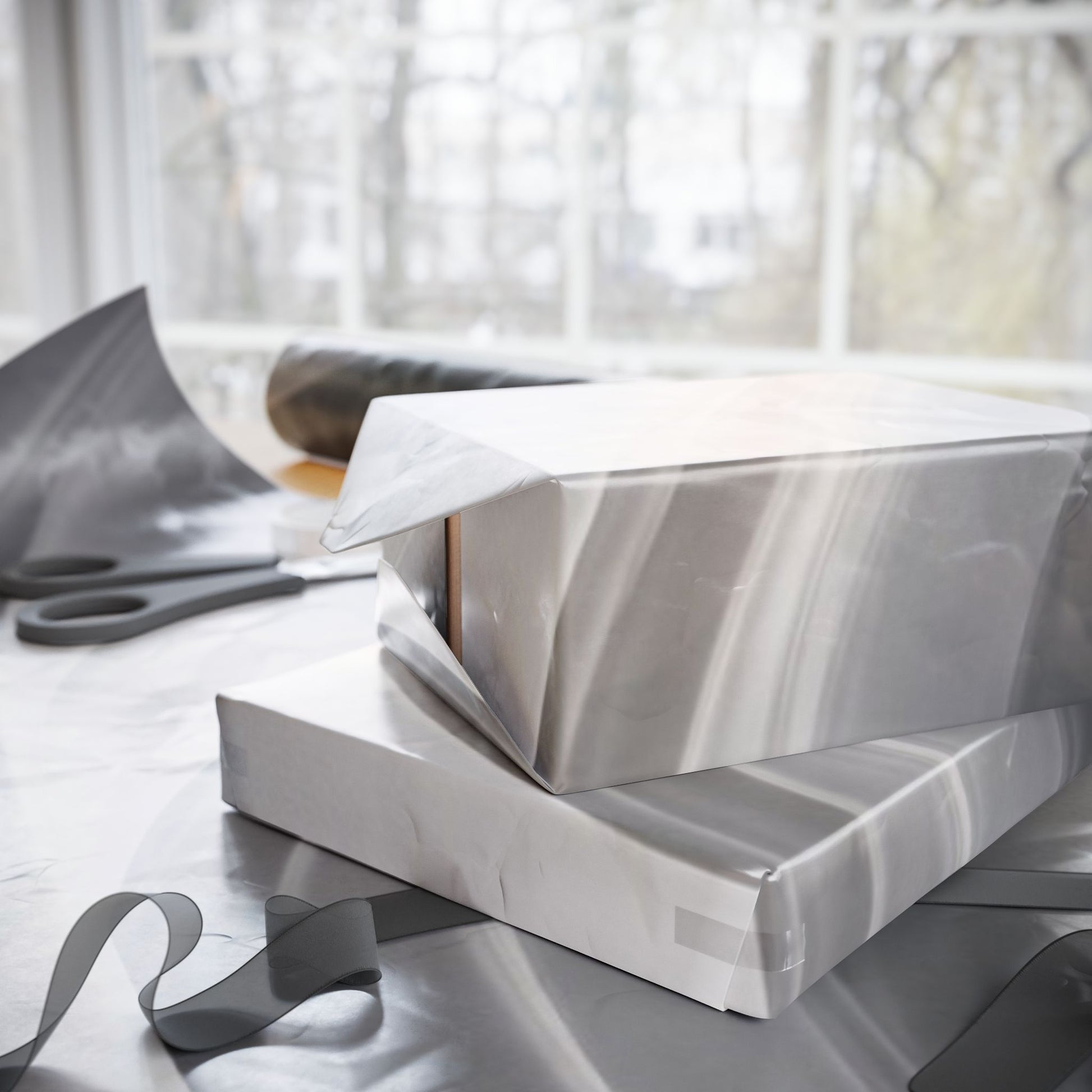 Silver marble swirl wrapping paper with abstract metallic design, perfect for gift wrapping from Printify.