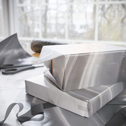 Silver marble swirl wrapping paper with abstract metallic design, perfect for gift wrapping from Printify.