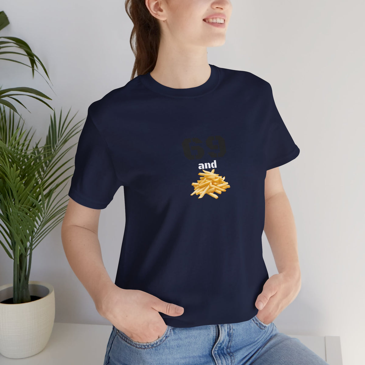 Unisex graphic T-shirt featuring a humorous 69 and French fries design in bold white print on a black fabric.