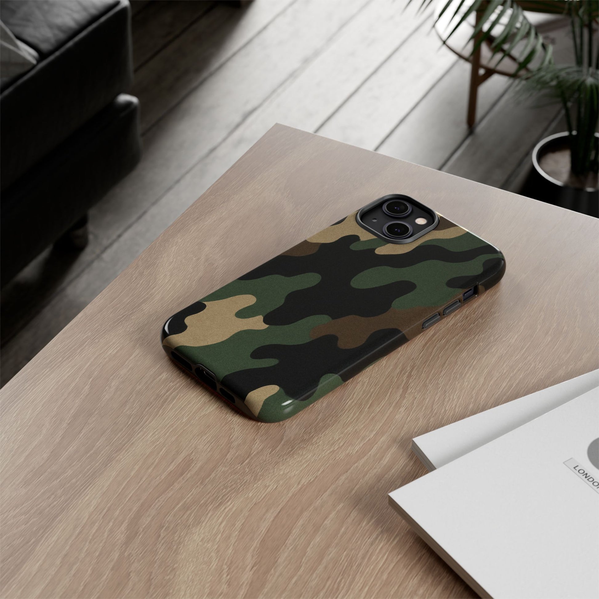 Rugged military green camo phone case by Printify protecting a smartphone with a tough, durable design.