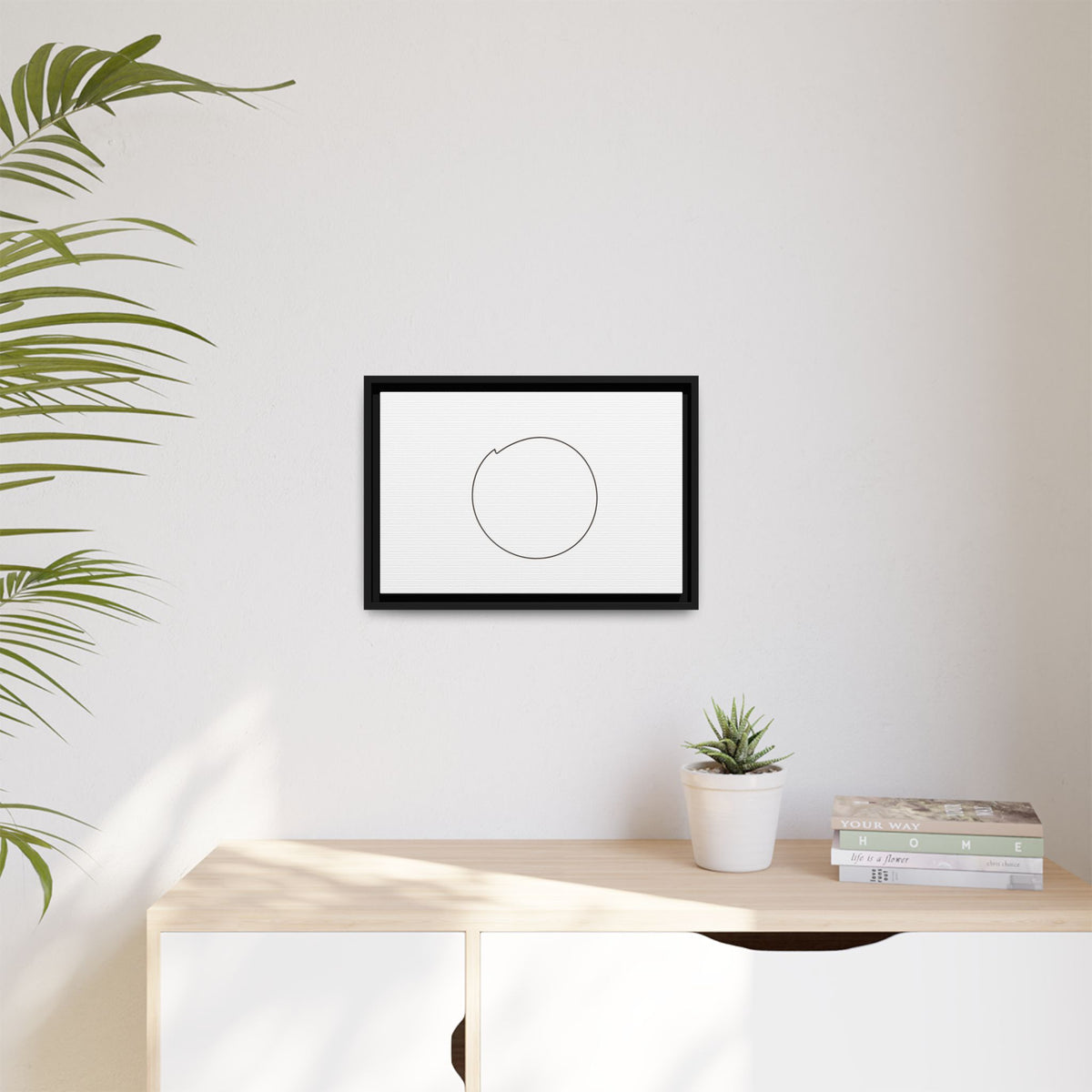 Framed matte canvas wall art featuring a minimal circular line design, ideal for modern home decor.