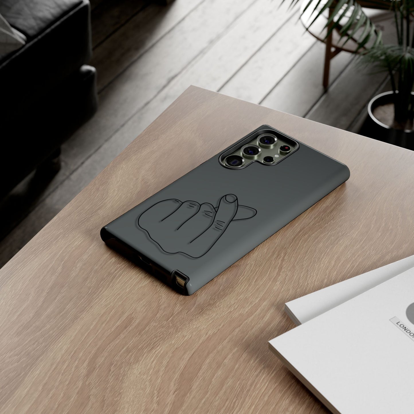 Silicone phone case with embossed Korean finger heart design, compatible with smartphones, by Printify.