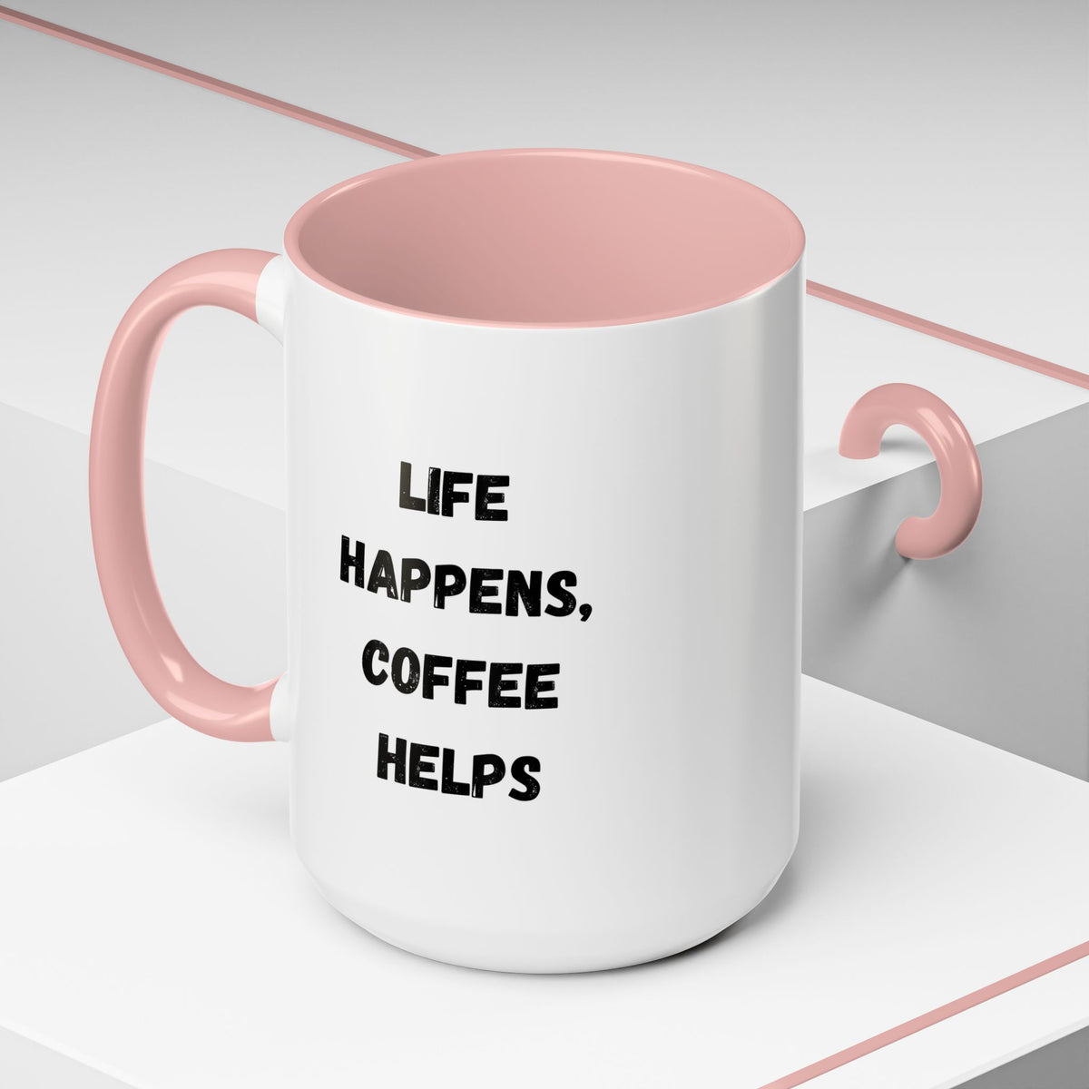 Black handle and rim ceramic mug featuring "Life Happens Coffee Helps" text, available in 11oz and 15oz sizes, by Printify.