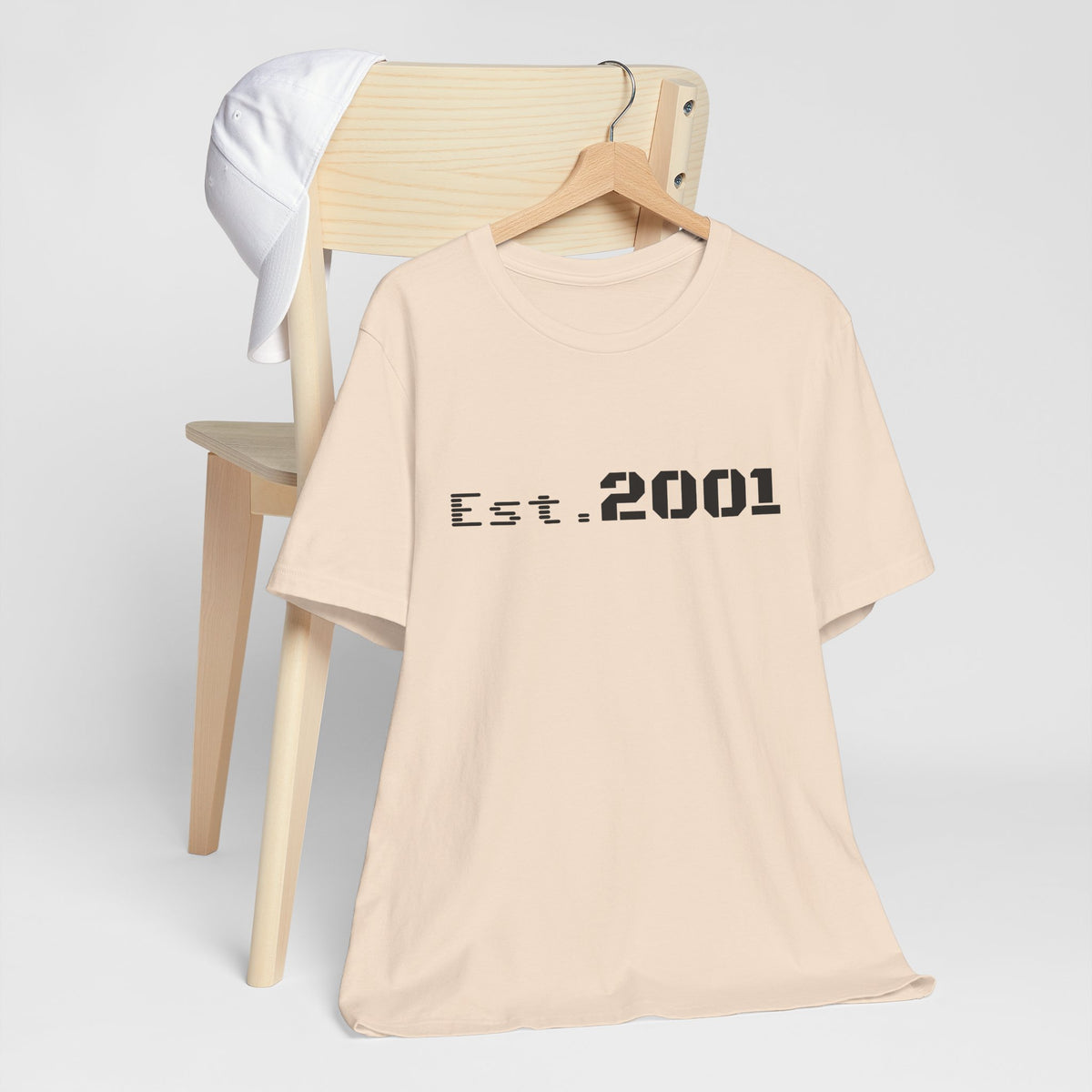 Retro minimalist Est. 2001 graphic T-shirt by Printify, featuring a simple birth year design on a casual T-shirt.