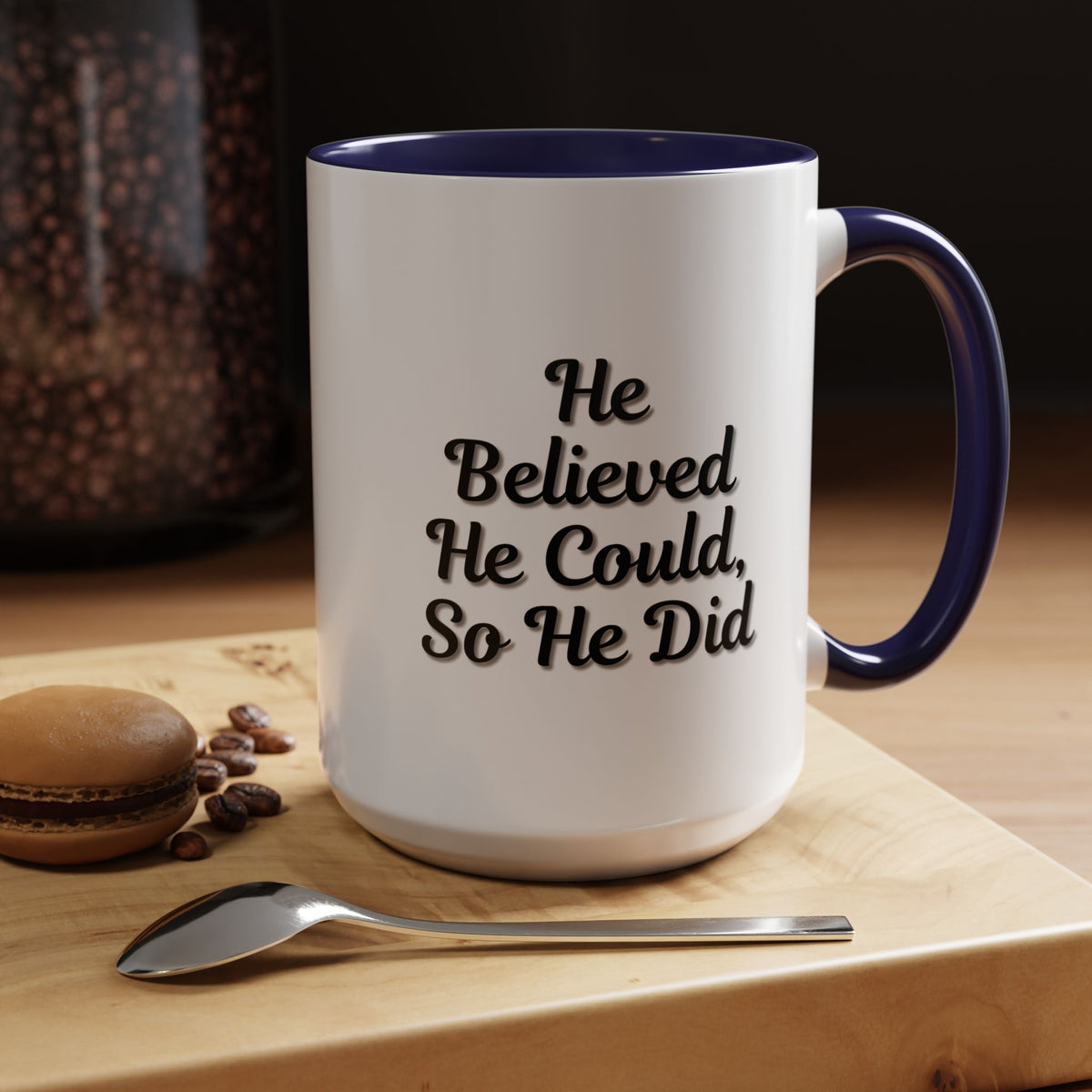 Printify "He Believed He Could So He Did" inspirational coffee mug with bold black text on a white ceramic surface.