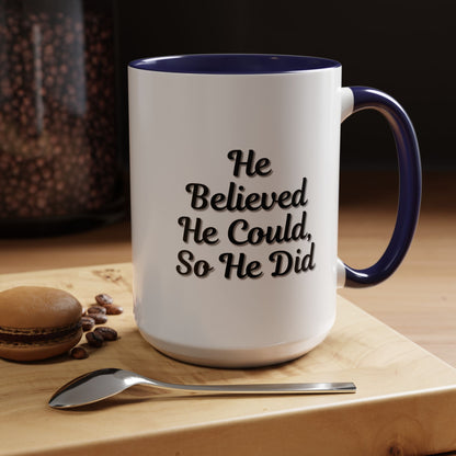 Printify "He Believed He Could So He Did" inspirational coffee mug with bold black text on a white ceramic surface.