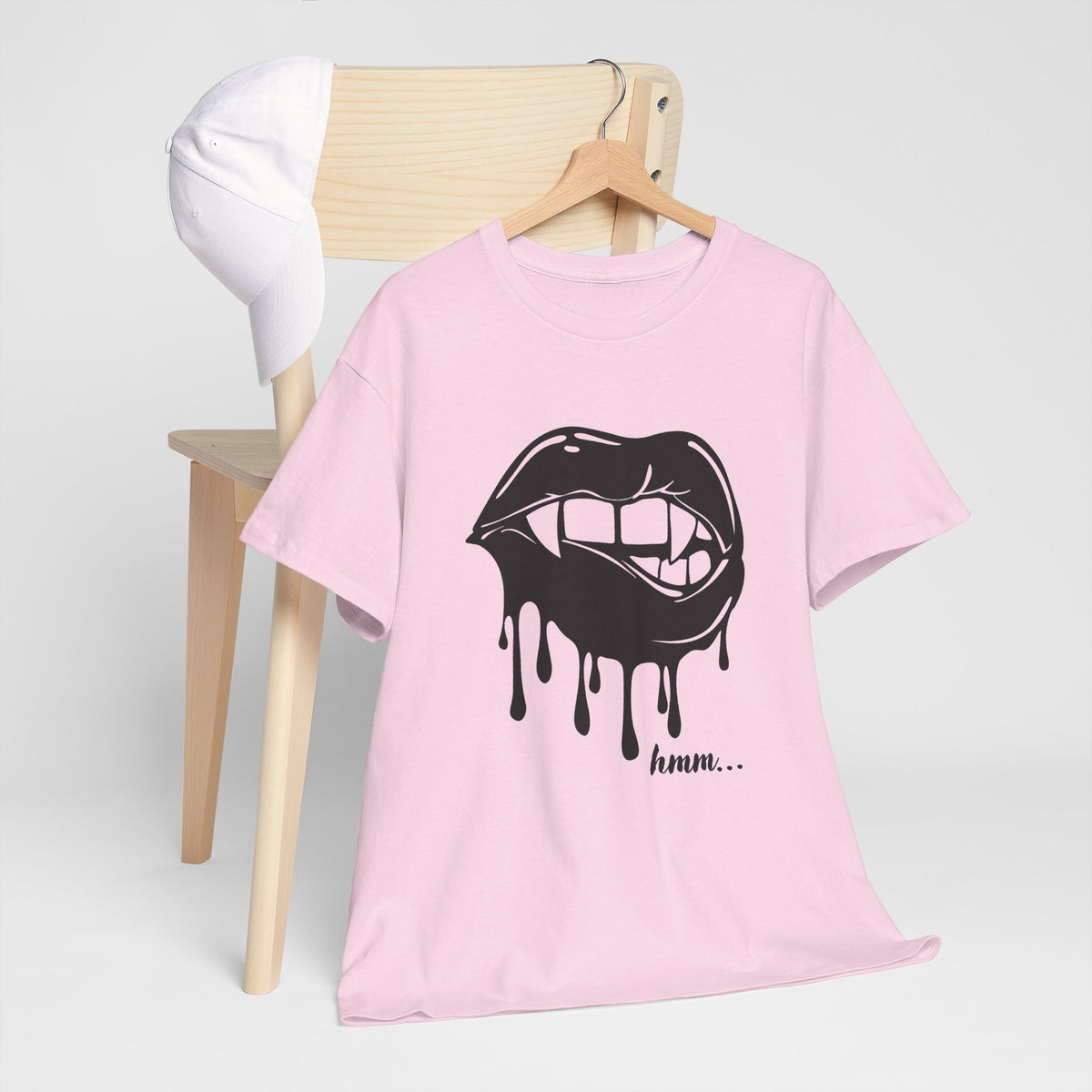 Graphic T-shirt by Printify featuring a dripping lips 'hmm...' bite design on a black cotton tee.