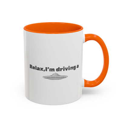 Ceramic coffee mug with "Relax, I’m Driving" UFO accent design, available in 11 or 15 oz sizes, by Printify.