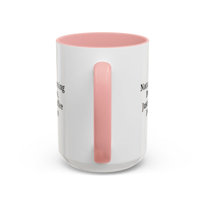 Ceramic coffee mug with "Not a Morning Person, Just a Coffee Person" text, featuring a handle and colorful design.