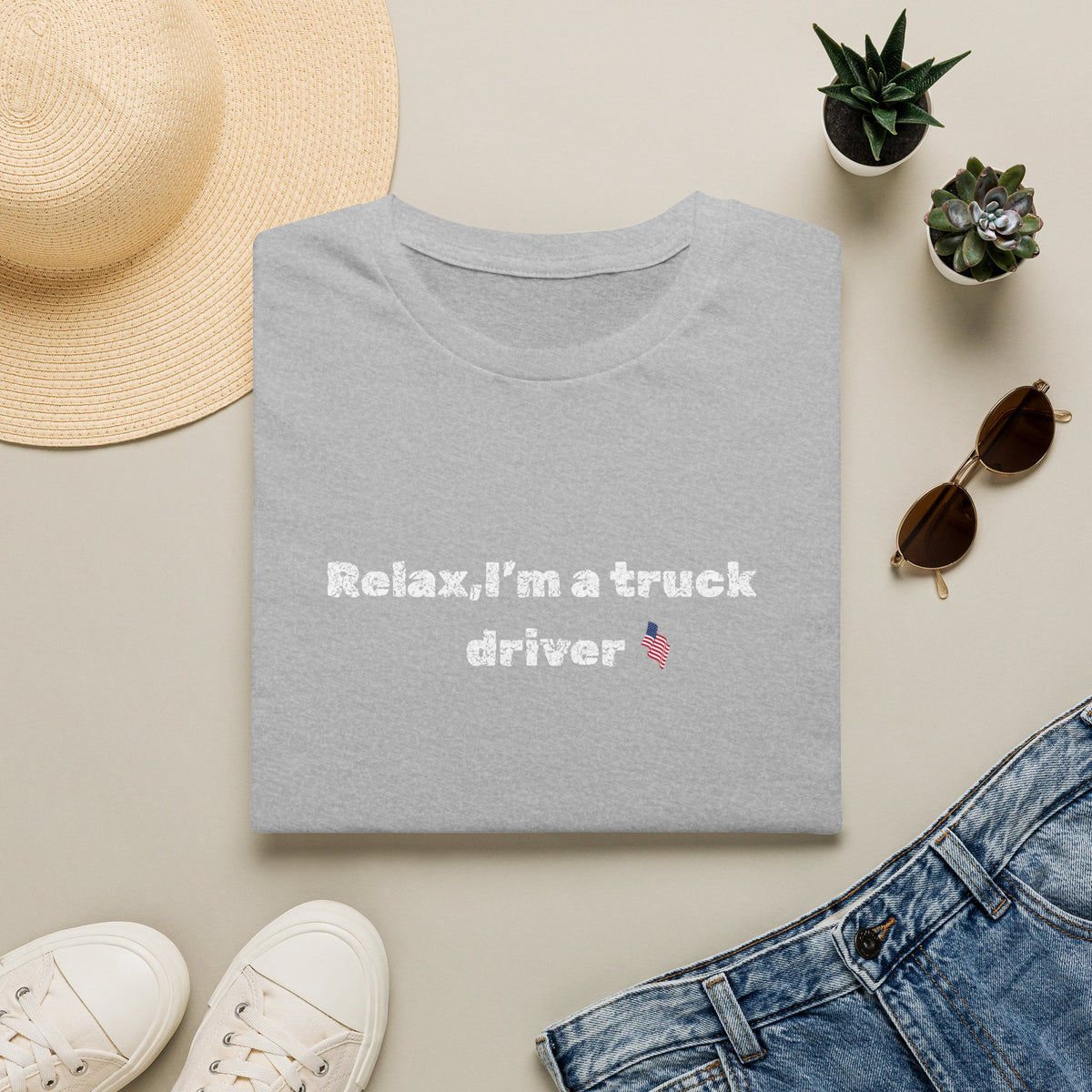 Pink heart graphic on a white Relax, I'm a Truck Driver T-Shirt featuring a humorous trucker slogan, casual and comfortable fit.