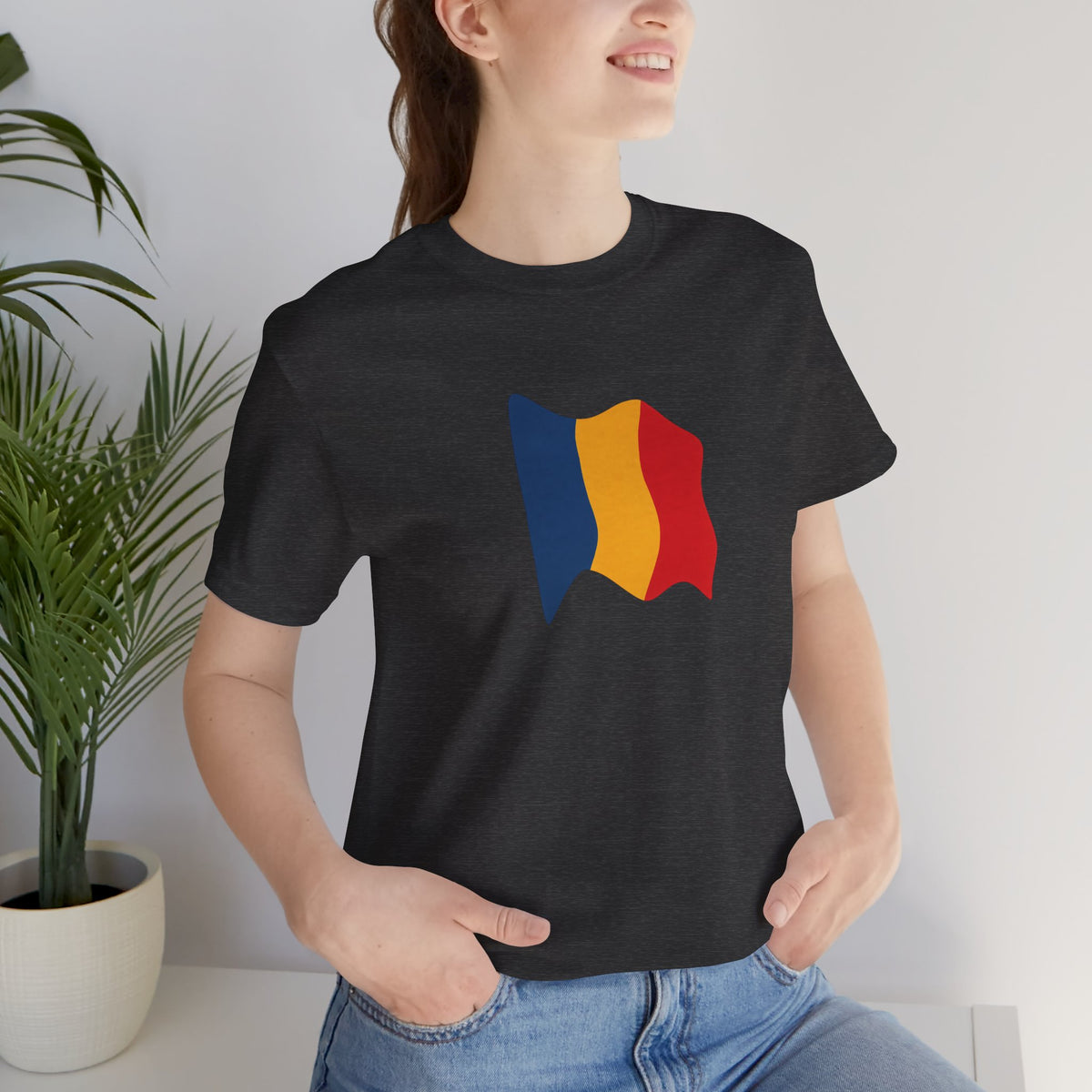 Romania flag T-shirt by Printify featuring a minimal waving tricolor design on a casual cotton tee.