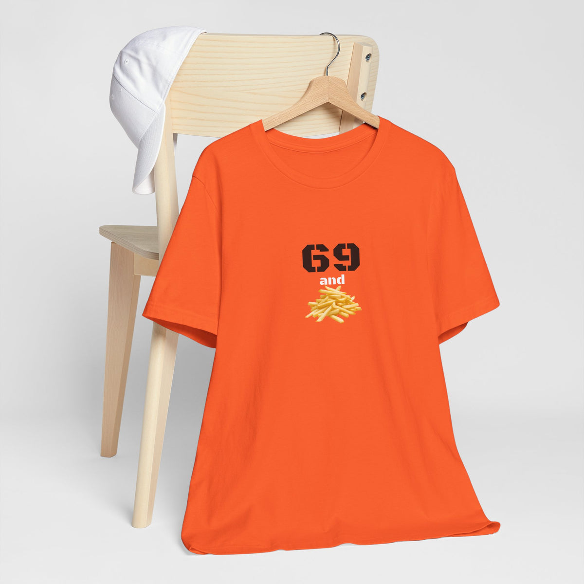 Unisex graphic T-shirt featuring a humorous 69 and French fries design in black and white, made by Printify.