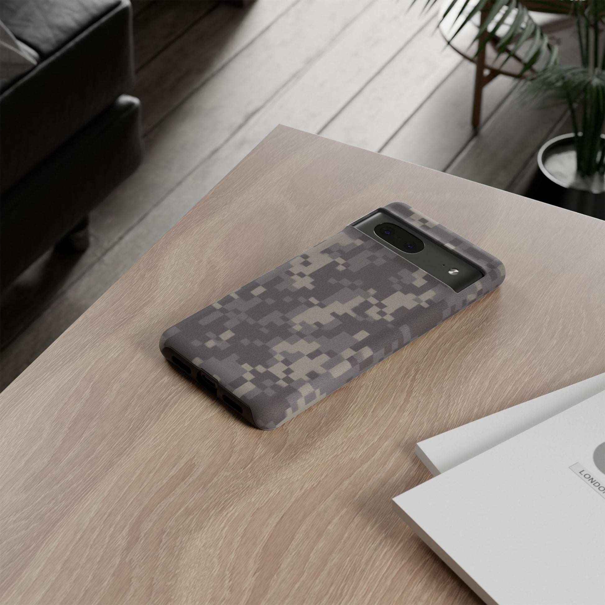 Rugged digital camo Printify tough phone case protecting a smartphone with durable camouflage design.