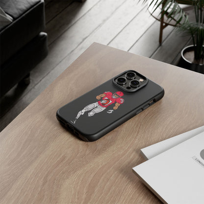 Black football player tough phone case for iPhone, protective sports design by Printify featuring a dynamic athletic scene.