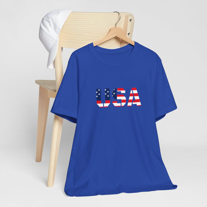 USA flag text T-shirt by Printify featuring patriotic Fourth of July design on a casual cotton tee.