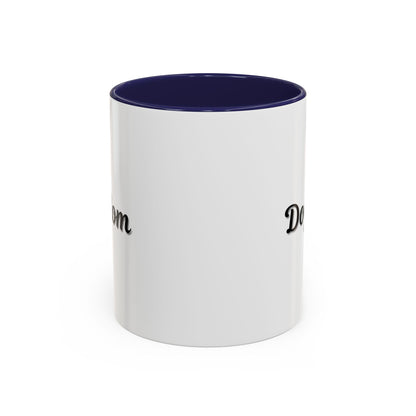 Dog Mom Accent Coffee Mug — white ceramic coffee mug with retro script "Dog Mom" print, colored interior and C-handle, 11oz/15oz, angled view on wooden table
