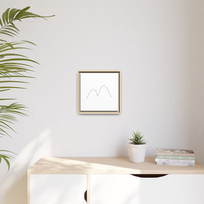 Framed minimalist mountain line art on matte canvas, modern wall decor by Printify with sleek black frame and simple mountain design.