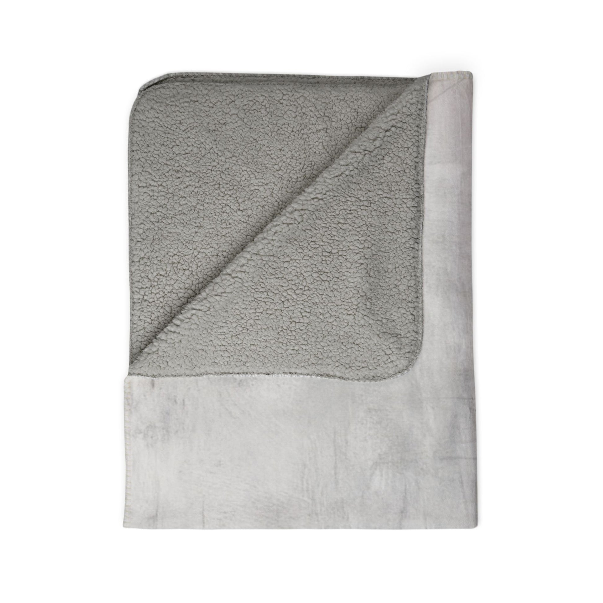 Soft Sherpa fleece throw blanket by Printify, perfect for cozy winter home decor, featuring plush texture and warm design.
