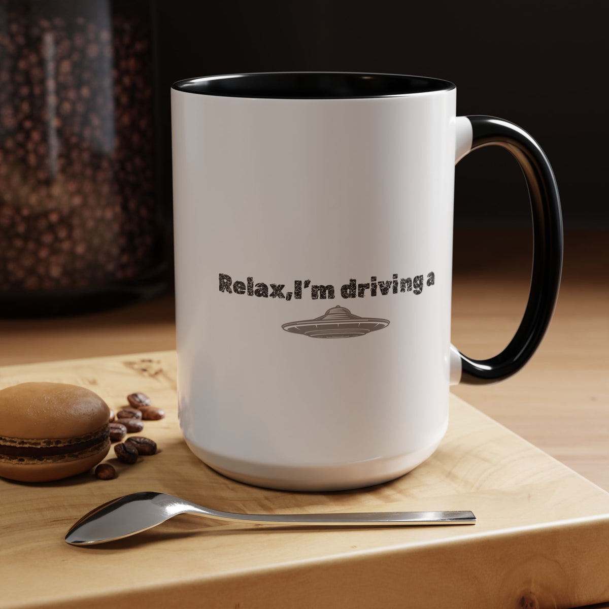 Ceramic coffee mug with "Relax, I’m Driving" and UFO accent design, available in 11 oz or 15 oz sizes.