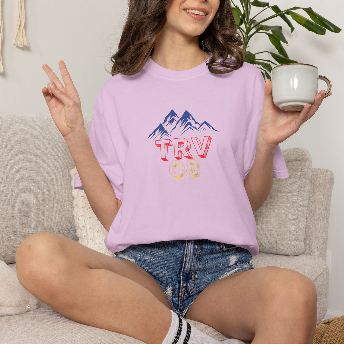 Unisex garment-dyed T-shirt with printed logo design, featuring the TRV08 Logo Tee branding on soft cotton fabric.
