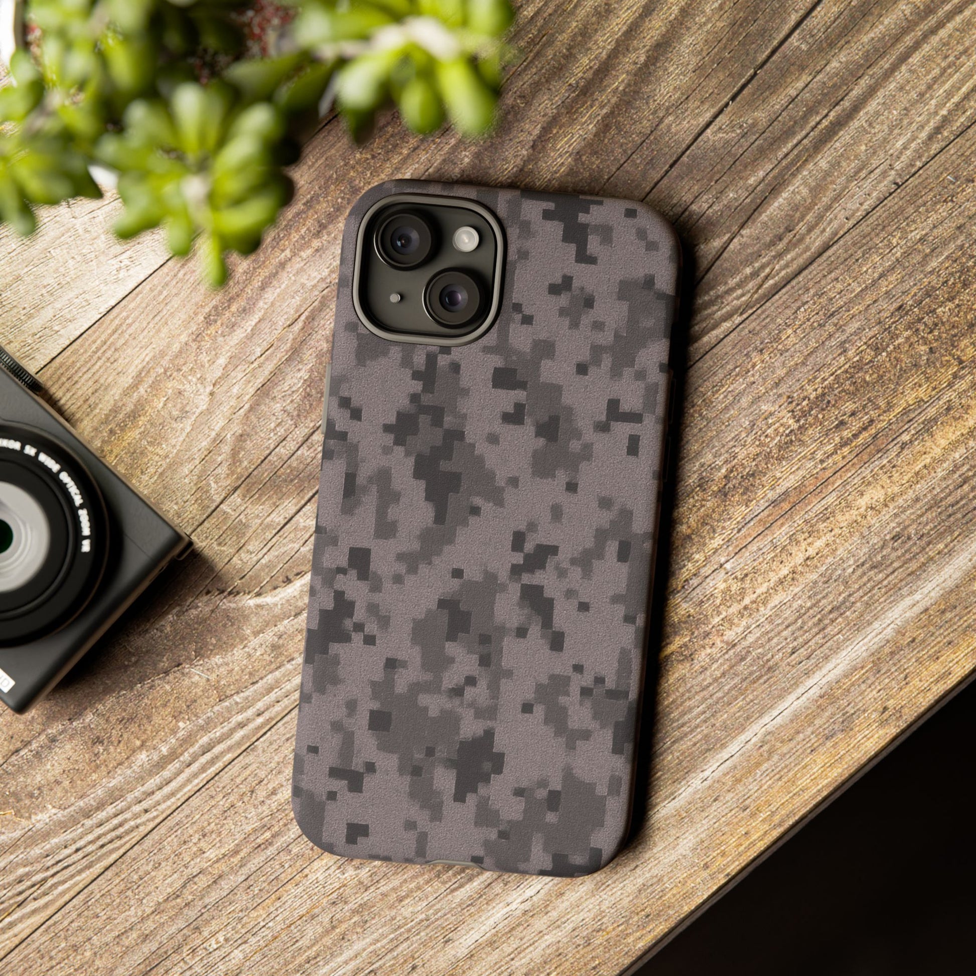 Gray digital camouflage phone case by Printify, featuring a tough protective cover for smartphones.