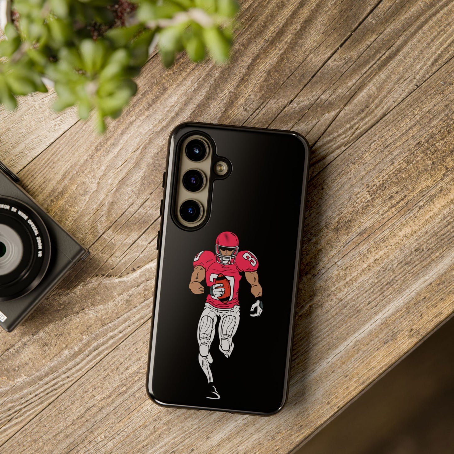 Black football player tough phone case for iPhone by Printify, featuring sports-themed protective design with a football player graphic.