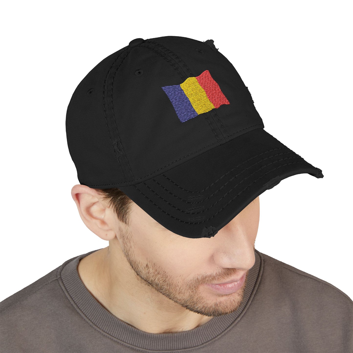 Distressed embroidered dad hat with Romanian flag patch, casual hat style from Printify featuring weathered denim fabric.