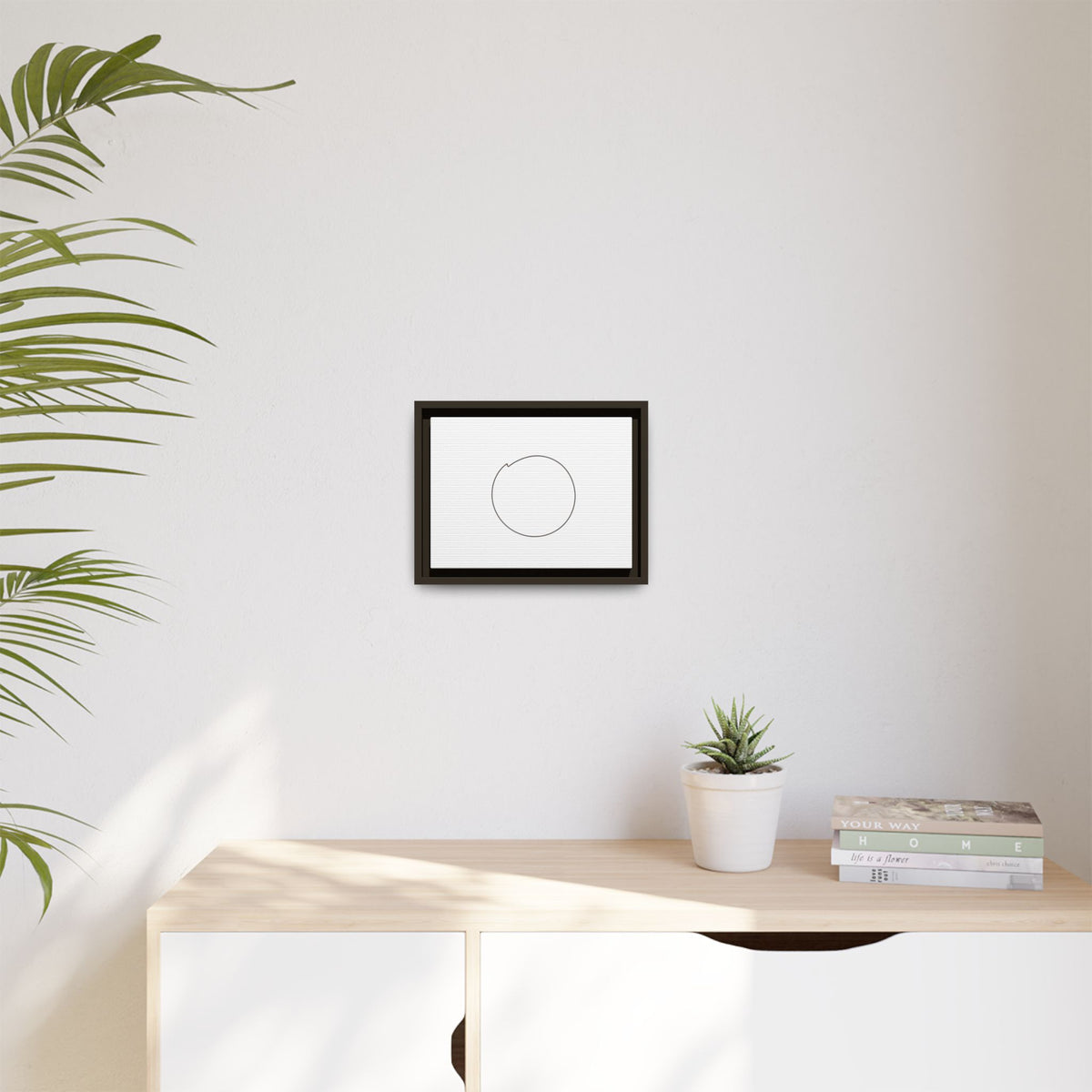 Framed matte canvas wall art featuring a minimal circular line design, perfect for modern home decor from Printify.